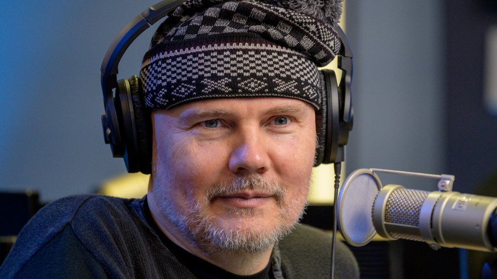 Bill Corgan wearing a winter hat and headphones 