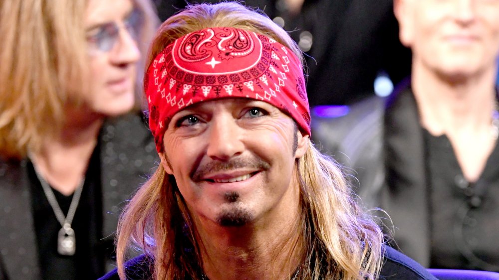 Bret Michaels smiling while wearing his trademark bandana