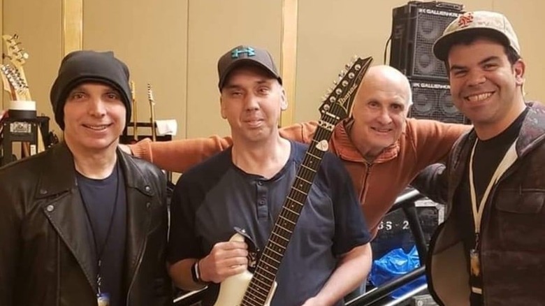 Mick Bridgen in a photo with Joe Satriani and others from Joe Satriani's Facebook page 