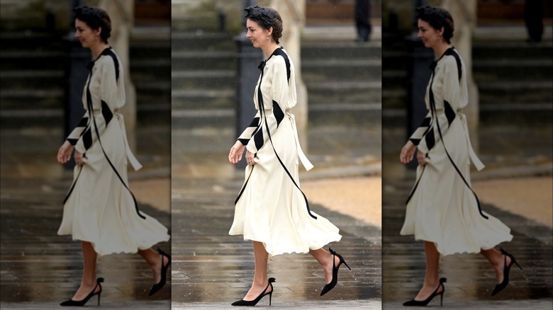 Rose Hanbury smiles while walking 