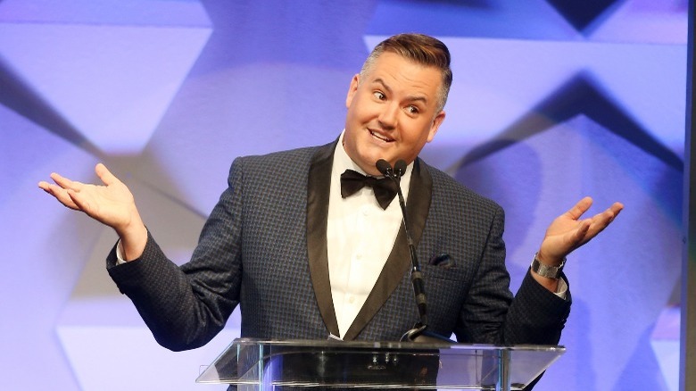 Ross Mathews with his hands up