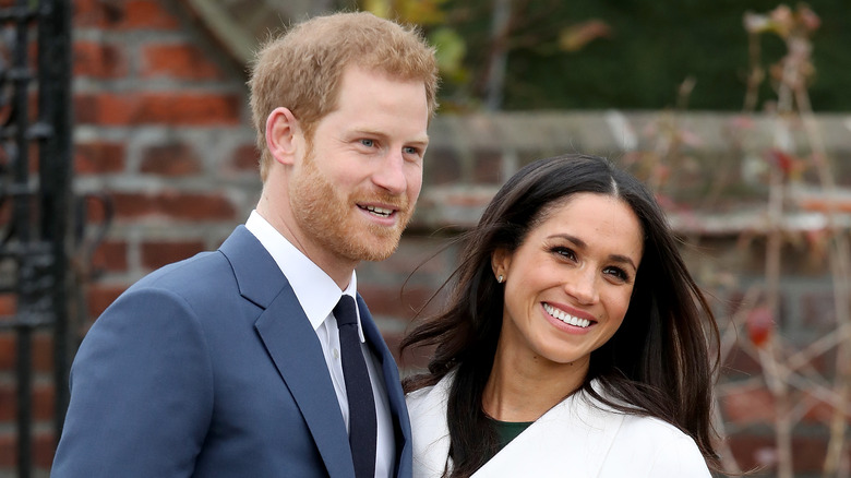 Prince Harry and Meghan Markle smiling