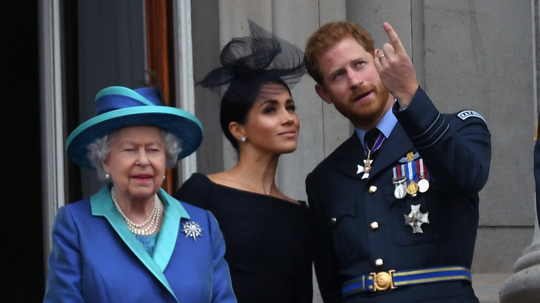 Queen Elizabeth with Prince Harry and Meghan Markle