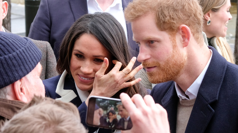 Meghan Markle and Prince Harry in a crowd