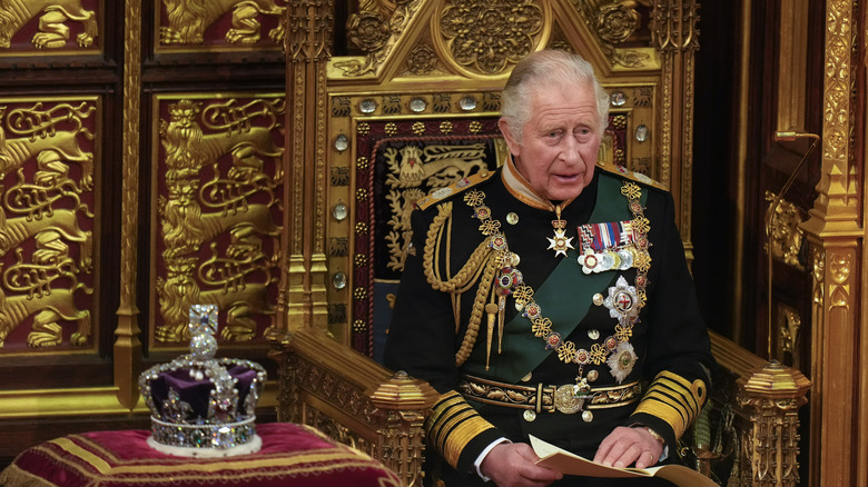 Prince Charles in fancy gold chair