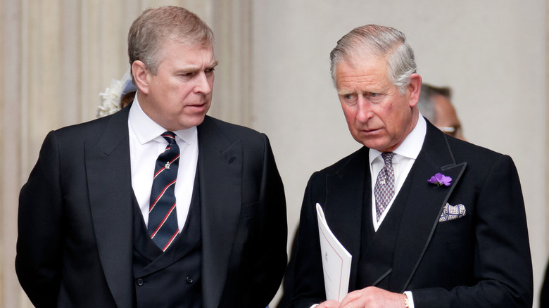 Frowning Prince Andrew and King Charles III