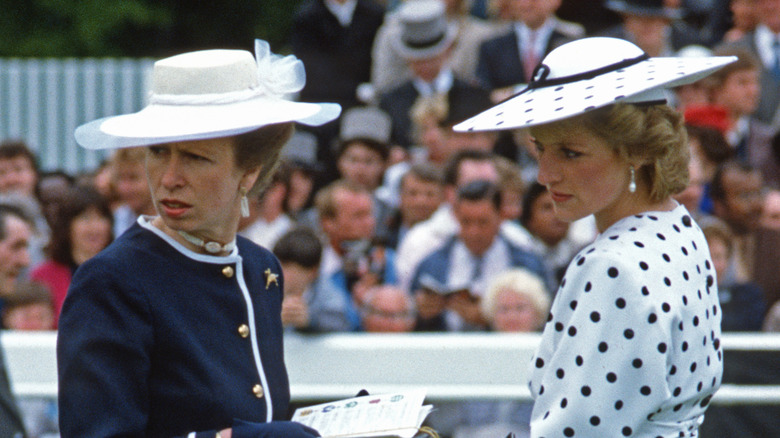 Princesses Anne and Diana at an event, looking away