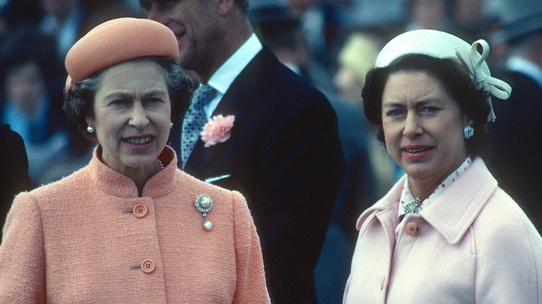 Queen Elizabeth II and Princess Margaret posing