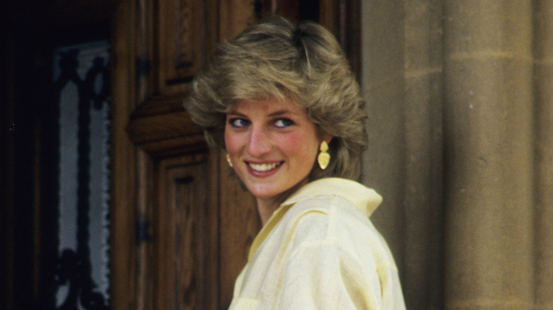 Princess Diana smiling over her shoulder