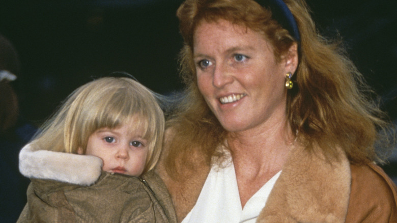 Sarah Ferguson holding Princess Beatrice