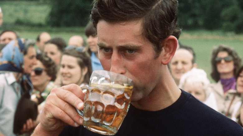 Prince Charles drinking a beer