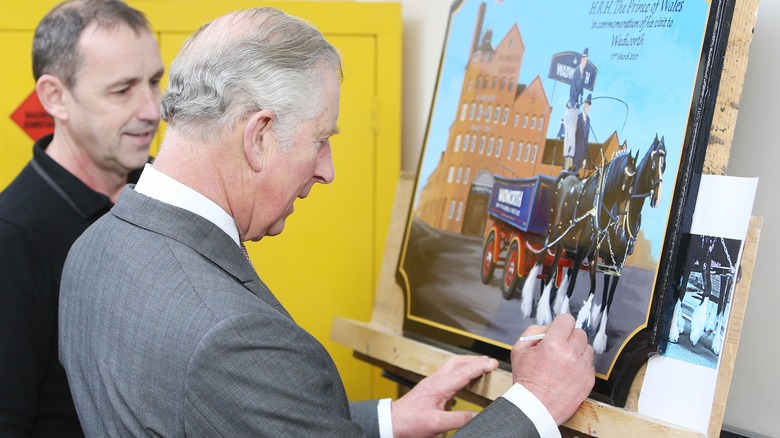 Prince Charles signing artwork