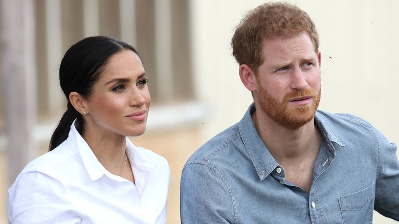 Prince Harry and Meghan Markle posing