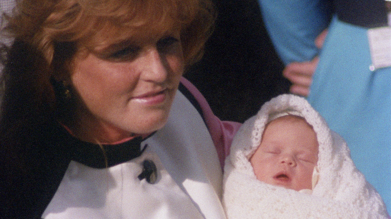 Sarah Ferguson holding baby Eugenie 