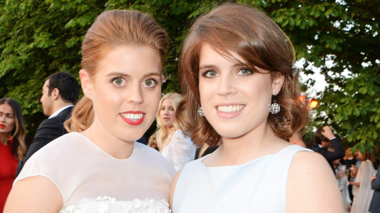 Princess Beatrice and Princess Eugenie posing 