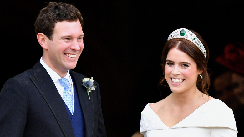 Jack Brooksbank and Princess Eugenie smiling on their wedding day