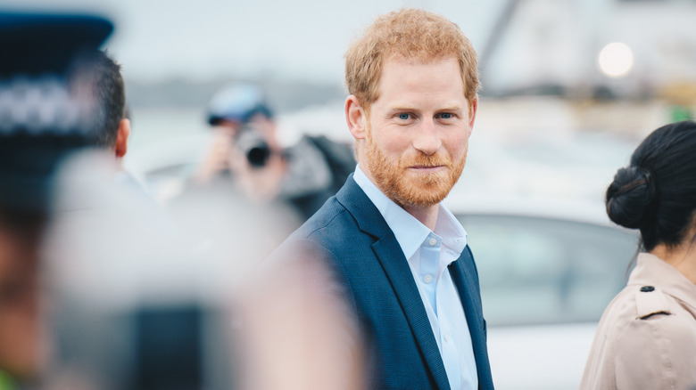 Prince Harry smiling outside