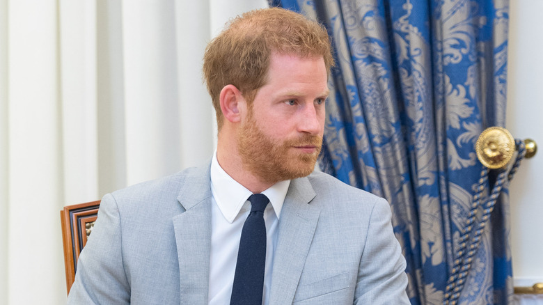 Prince Harry with head turned to side