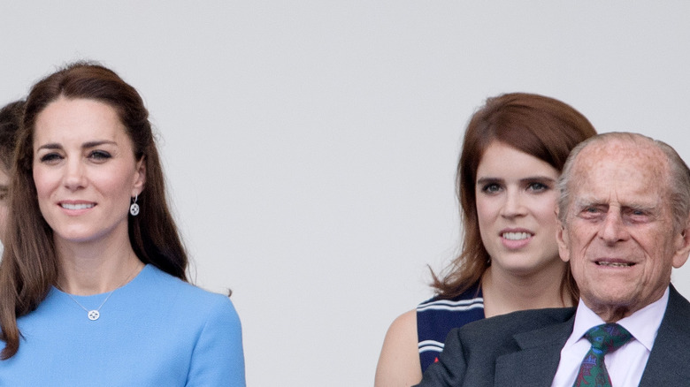 Kate Middleton, Princess Eugenie, and Prince Philip smiling