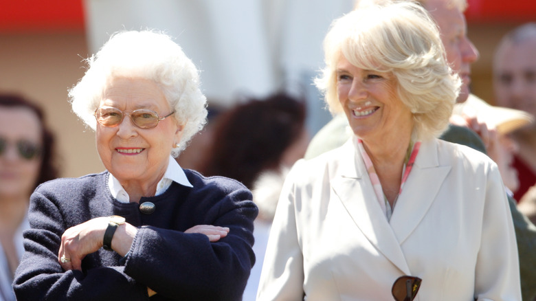 Queen Elizabeth II and Queen Camilla smiling