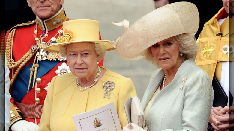 Queen Elizabeth and Camilla Parker Bowles wearing hats