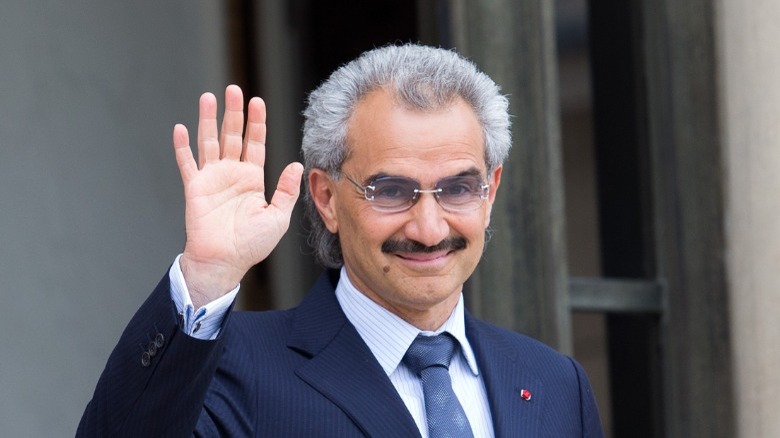 Prince Alwaleed bin Talal waves to camera