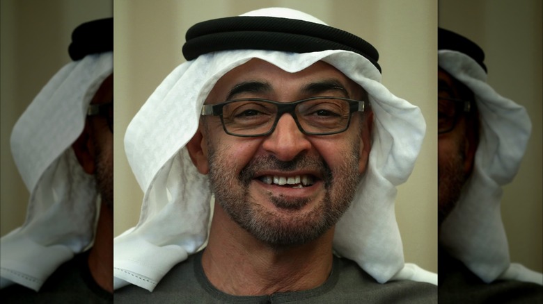 Mohamed bin Zayed Al Nahyan smiling to show crooked teeth