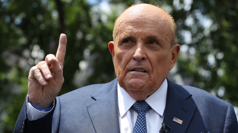 Rudy Giuliani putting his finger up