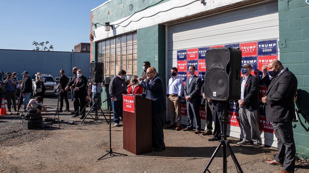 Rudy Giuliani holding a press conference at Four Seasons Total Landscaping 