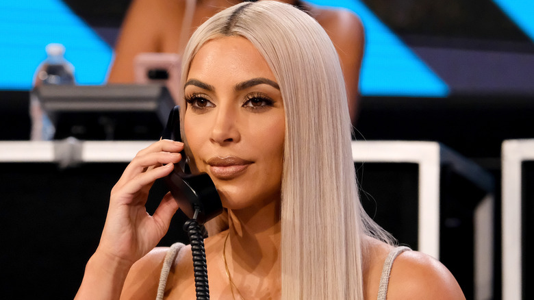Kim Kardashian on the phone