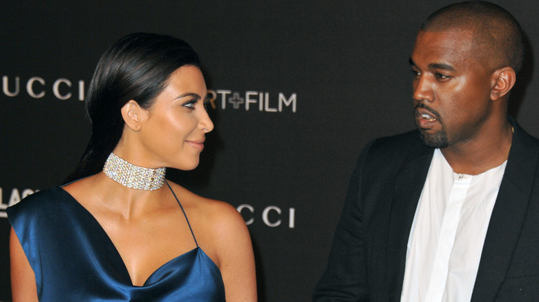 Kim Kardashian, Kanye West looking at her face not happy