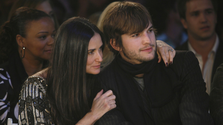 Demi Moore with arm around Ashton Kutcher