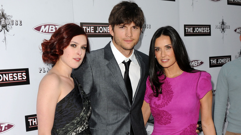 Rumer Willis posing with Demi Moore and Ashton Kutcher