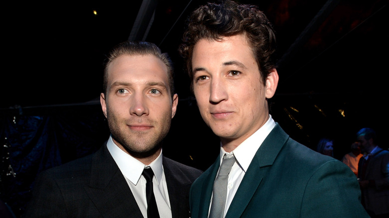 Jai Courtney and Miles Teller smiling