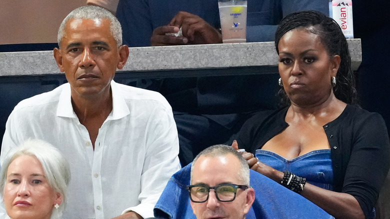 Barack Michelle Obama looking glum