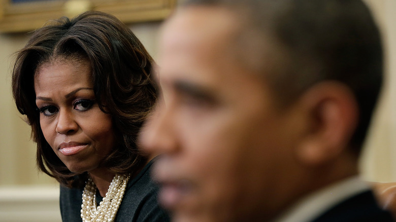 Michelle Obama staring at Barack Obama