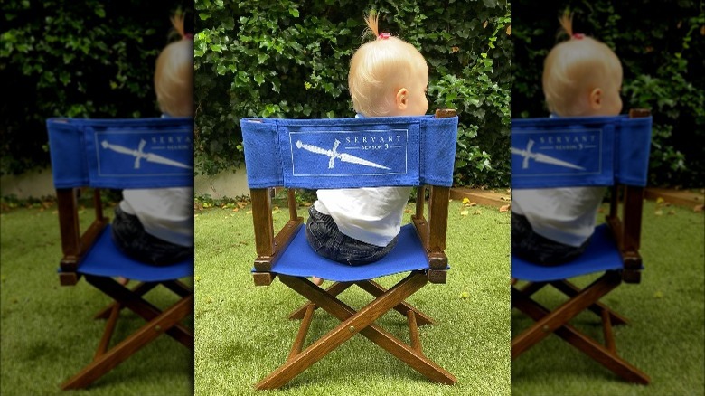 Rupert Grint's daughter sitting in a director's chair