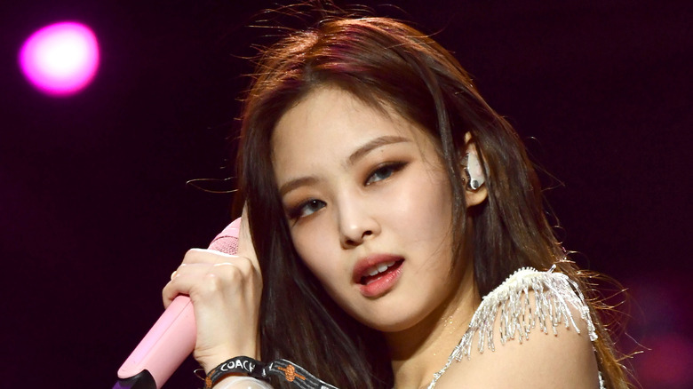 Blackpink member Jennie poses while singing