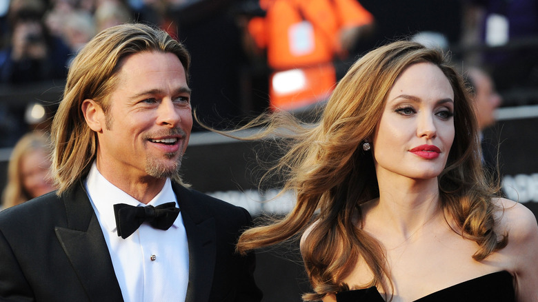 Brad Pitt and Angelina Jolie pose on the red carpet