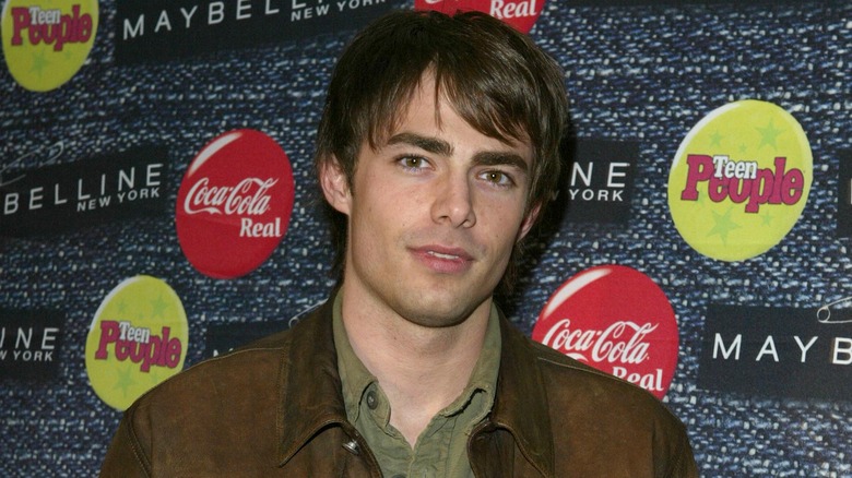 Jonathan Bennett wearing brown coat