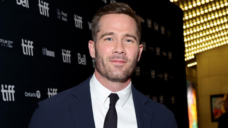 Luke Macfarlane wearing black tie