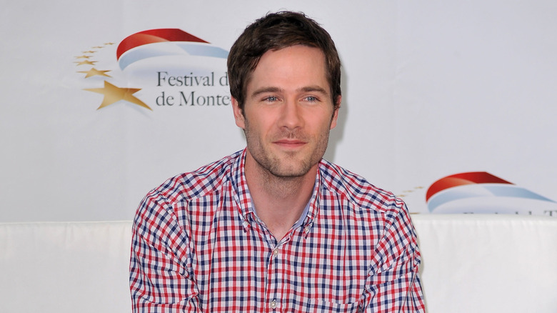 Luke Macfarlane wearing plaid shirt