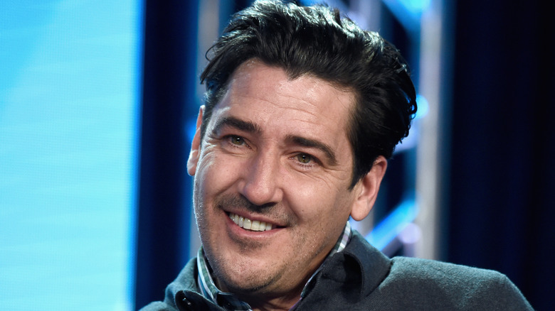 Jonathan Knight smiles during interview