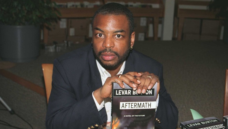 LeVar Burton holding book