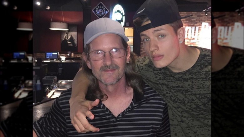 Matt Rife with arm around grandfather