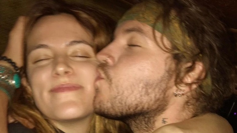 Benjamin Keough kissing Riley Keough on cheek