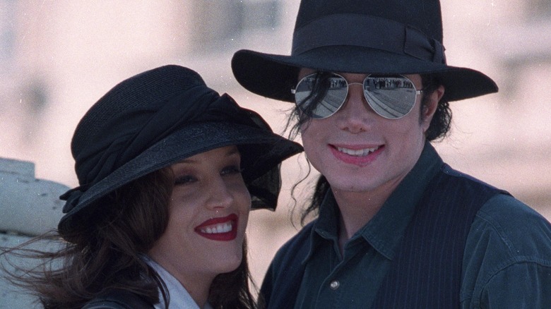 Lisa Marie Presley and Michael Jackson both smiling