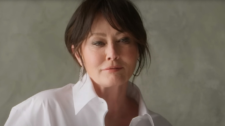 Shannen Doherty posing in a white shirt