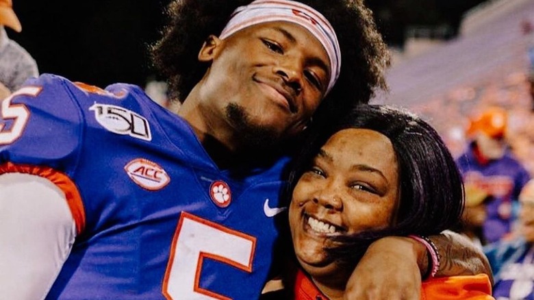 Tee Higgins and his mother smiling for a picture