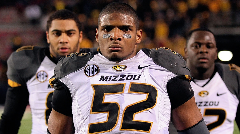 Michael Sam standing with teammates